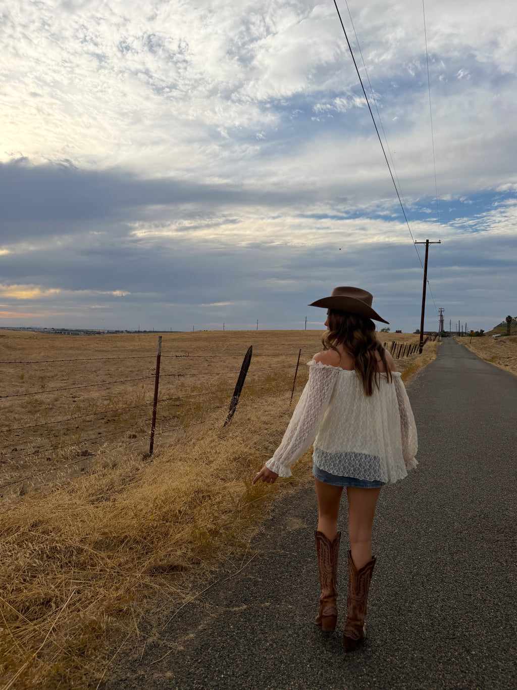 off the should long sleeve top, see through lace arms and white mid section, country western inspired. 