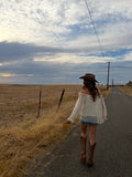 off the should long sleeve top, see through lace arms and white mid section, country western inspired. 