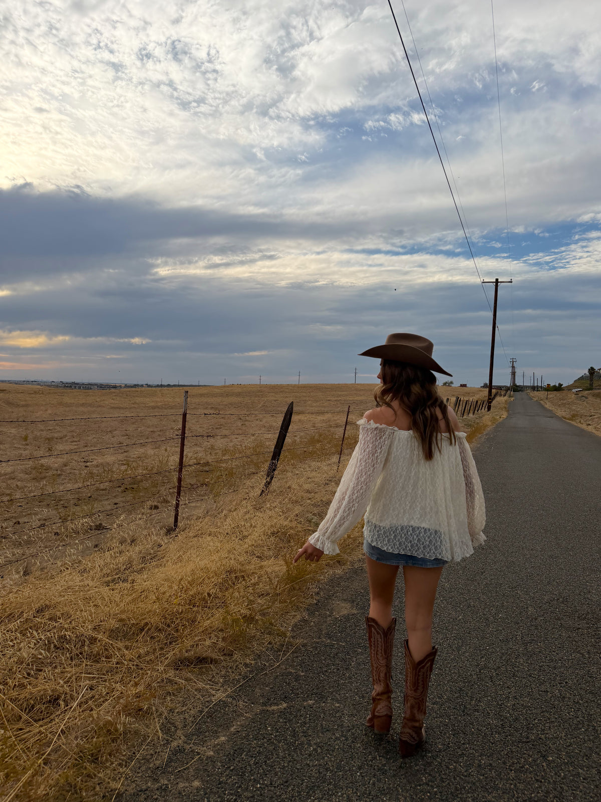 off the should long sleeve top, see through lace arms and white mid section, country western inspired. 