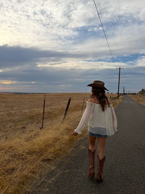 off the should long sleeve top, see through lace arms and white mid section, country western inspired. 