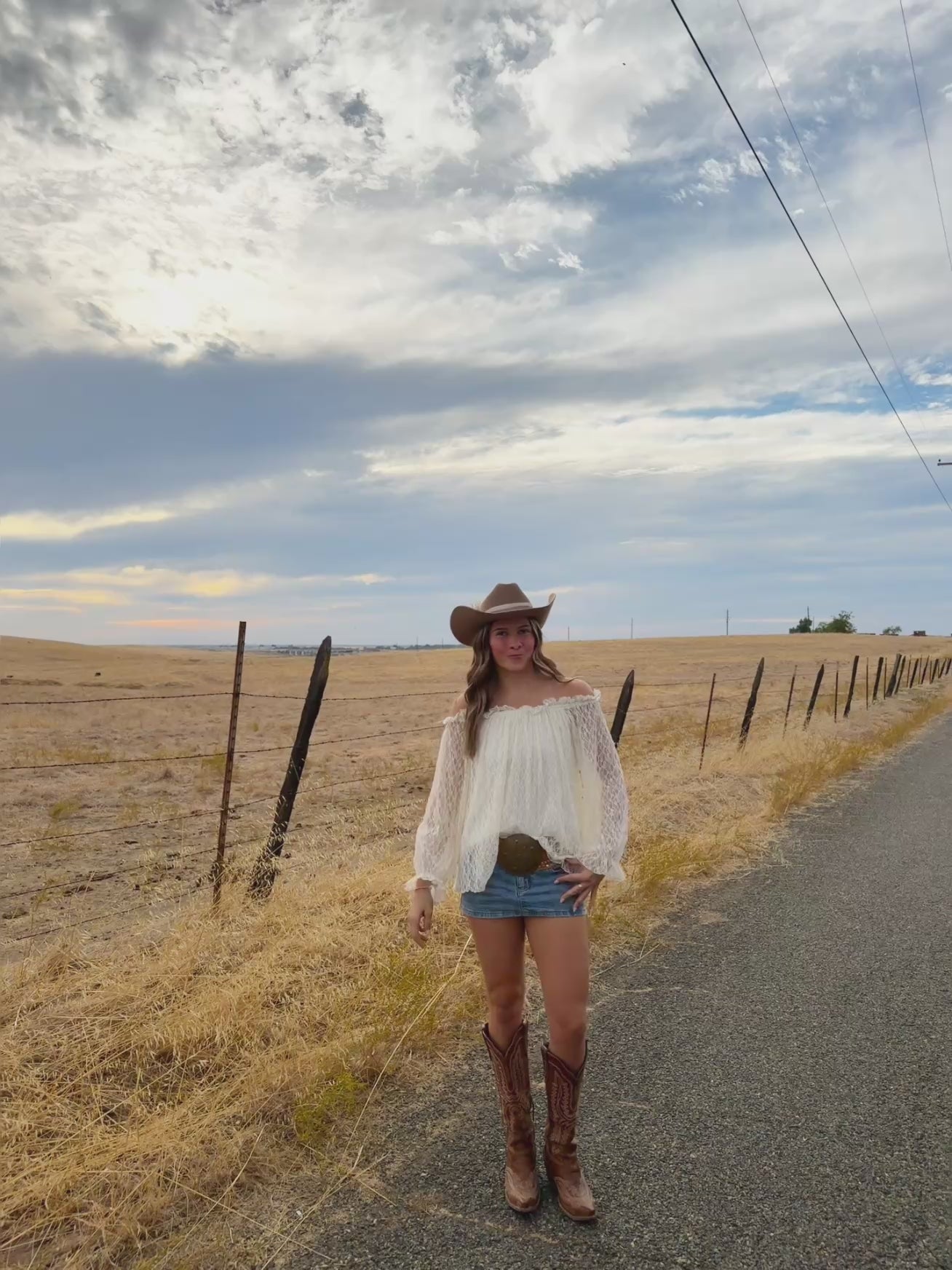 off the should long sleeve top, see through lace arms and white mid section, country western inspired. 